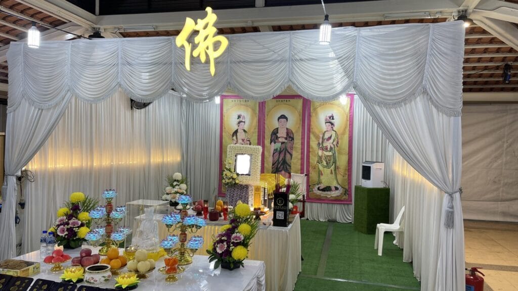 Modern Buddhist funeral altar by Embrace Funeral Services with premium floral aesthetics.