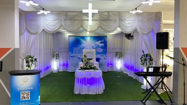 Elegant Christian funeral service at a parlor with high-end floral styling by Embrace.
