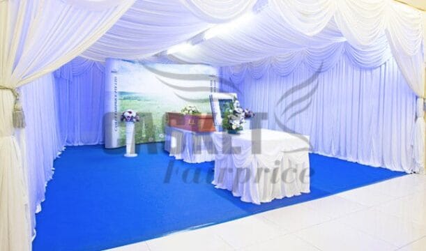 Secular freethinker memorial setup by Casket Fairprice featuring personalized photo displays.
