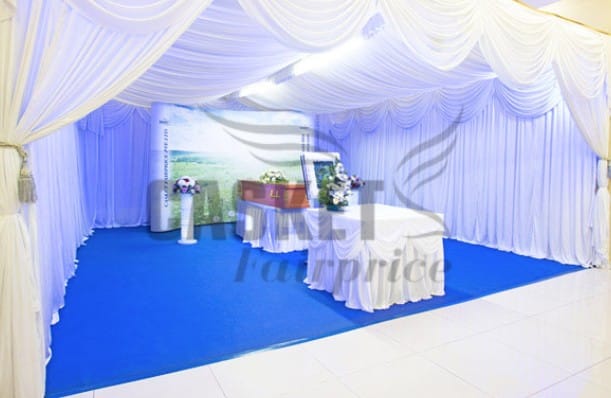 Secular freethinker memorial setup by Casket Fairprice featuring personalized photo displays.