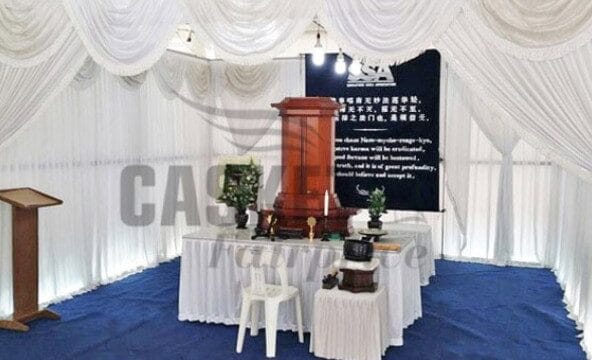 Soka memorial setup by Casket Fairprice featuring personalized photo displays.