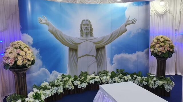 Catholic funeral wake setup by Lee Teoh Heng Undertaker with religious statue and blue ambient lighting