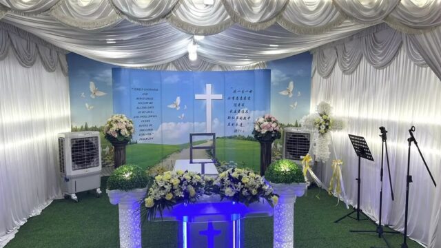 Christian funeral wake setup by Lee Teoh Heng Undertaker with white draping and cross backdrop