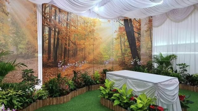 Freethinker funeral wake setup by Lee Teoh Heng Undertaker with nature-themed backdrop