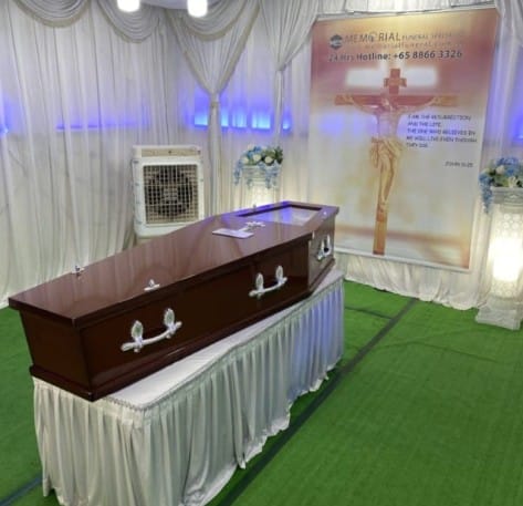 Catholic funeral wake setup at Memorial Funeral featuring elegant white drapes.