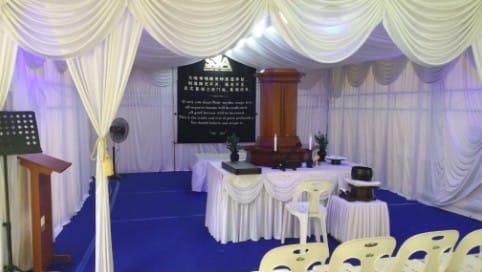 Soka funeral wake setup at Memorial Funeral featuring a elegant white drapes.