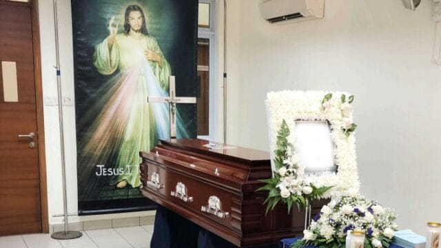 Catholic funeral wake setup by Singapore Funeral featuring a serene prayer space.