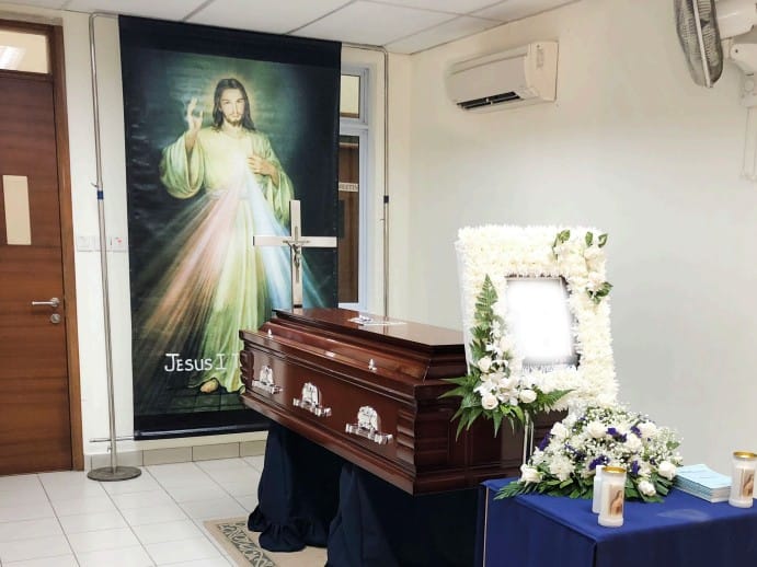 Catholic funeral wake setup by Singapore Funeral featuring a serene prayer space.