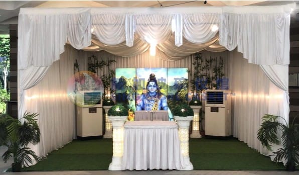 Hindu funeral setup at Singapore Casket with traditional ritual space and floral garlands.