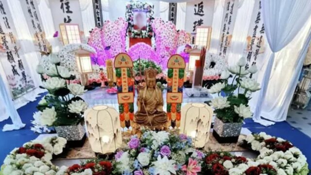 Buddhist funeral wake setup by Eternity Funeral Service with floral altar in Singapore