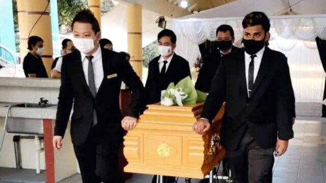 Funeral pallbearers carrying casket for Eternity Funeral Service in Singapore