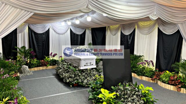 Free Thinker funeral wake setup by Singapore Funeral & Casket Services with white draping and floral arrangement