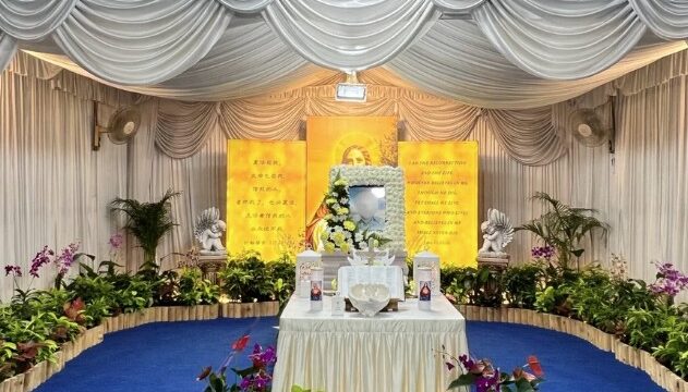 Christian funeral wake setup by Unity Casket with draped altar and floral arrangement in Singapore
