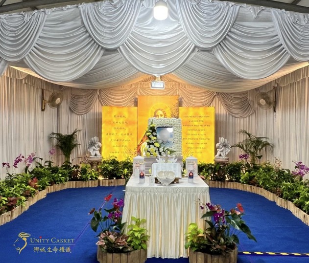 Christian funeral wake setup by Unity Casket with draped altar and floral arrangement in Singapore