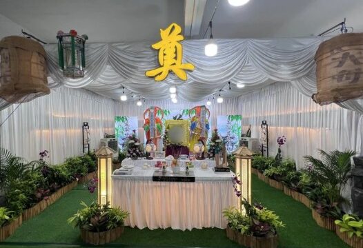 Taoist funeral wake setup by Unity Casket with traditional altar and deity figure in Singapore